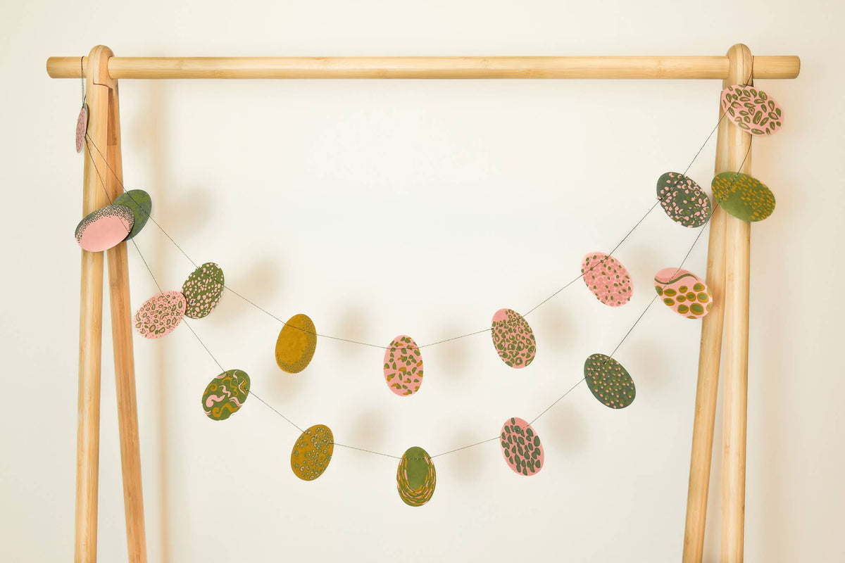 Pink Easter Eggs Screen Printed Paper Garland hung to show egg designs by east end press at penny black