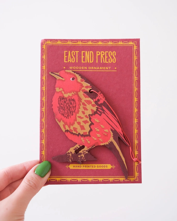 Red, brown and yellow hand screen printed robin laser cut shape on a red backing card