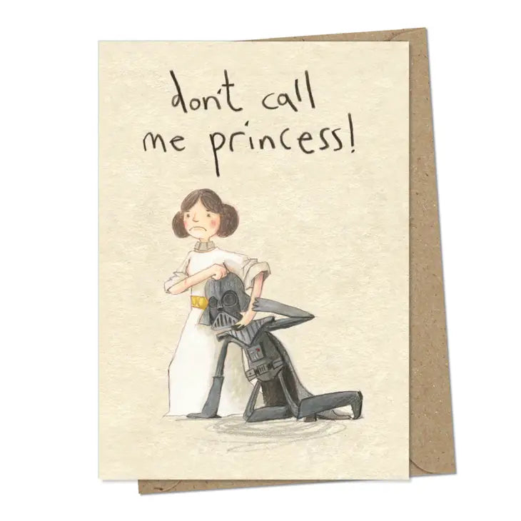 A cream coloured rectangular card with an illustration of Princess Leia with Darth Vader in a headlock. He is on the ground and she&#39;s got her hand around his helmet. Above the image are the handwritten words &#39;Don&#39;t call me princess&#39;